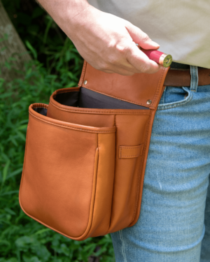 Hunter grabs shells from his leather shell bag