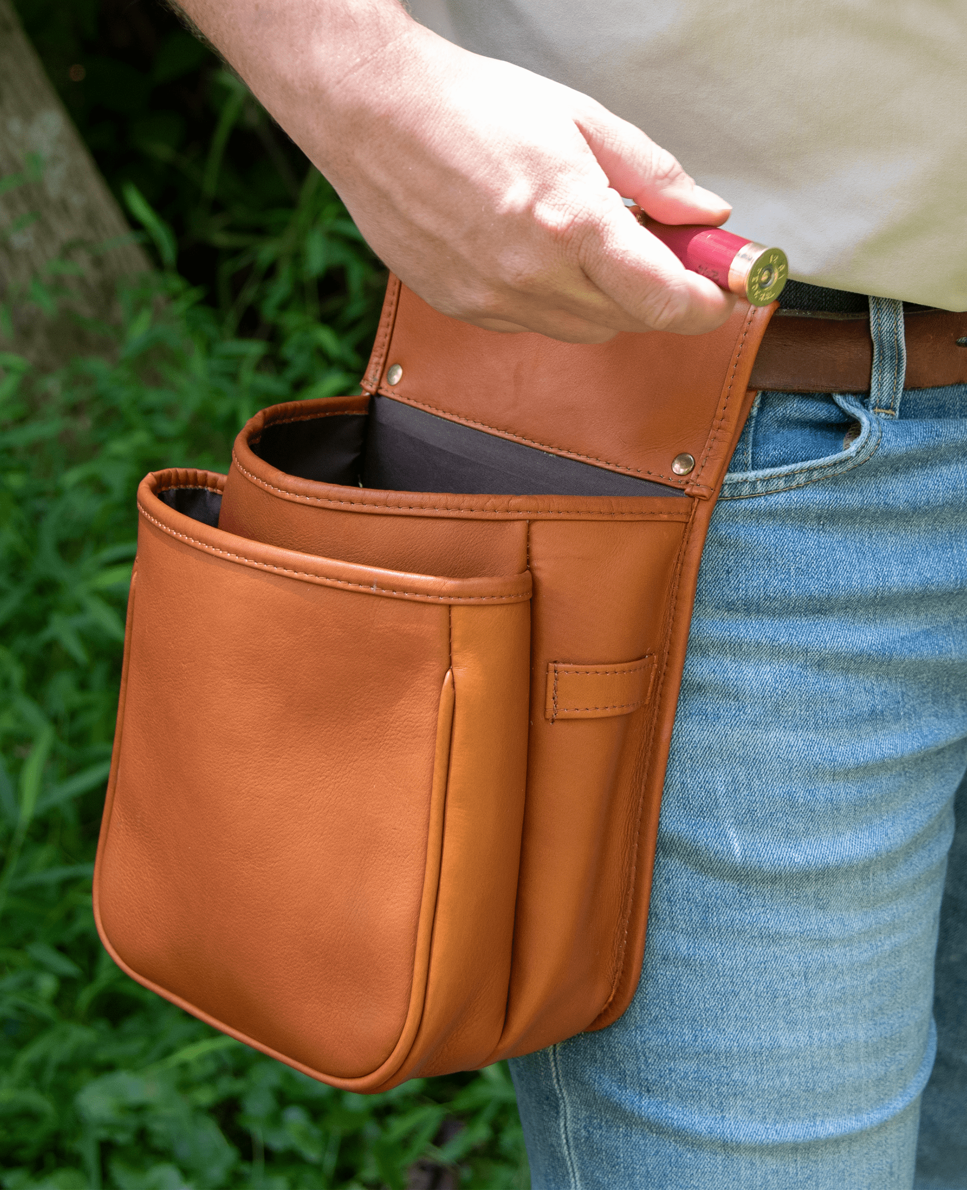 Hunter grabs shells from his leather shell bag