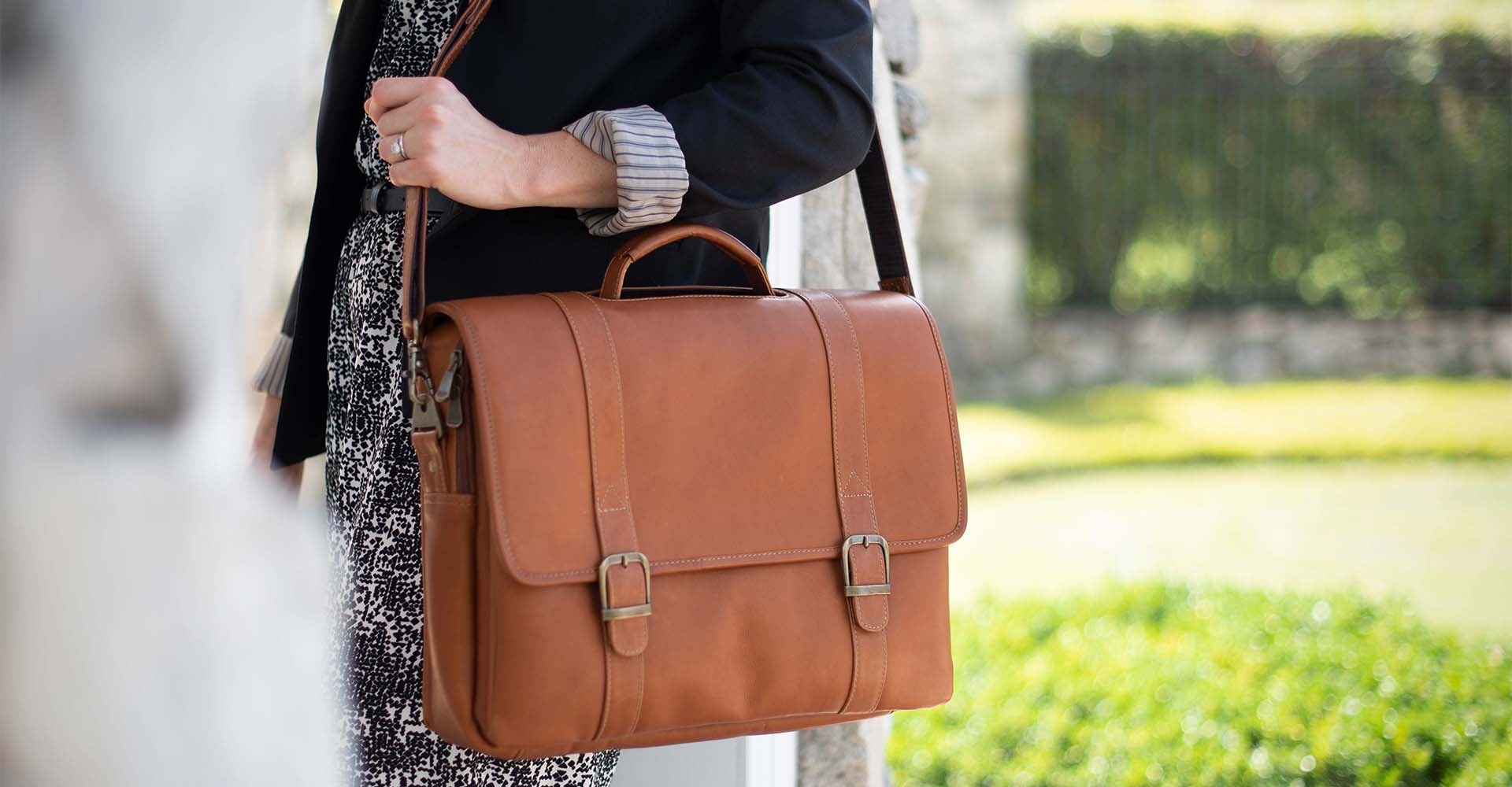 Woman walking with a Sarge Leather messenger briefcase