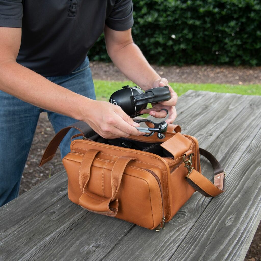 Man packing a leather bag